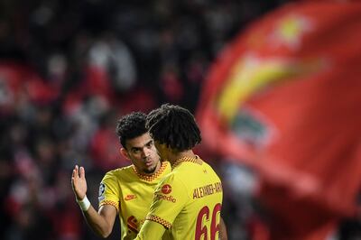 Liverpool's Luis Diaz (L) celebrates with Trent Alexander-Arnold at the end of the match. AFP