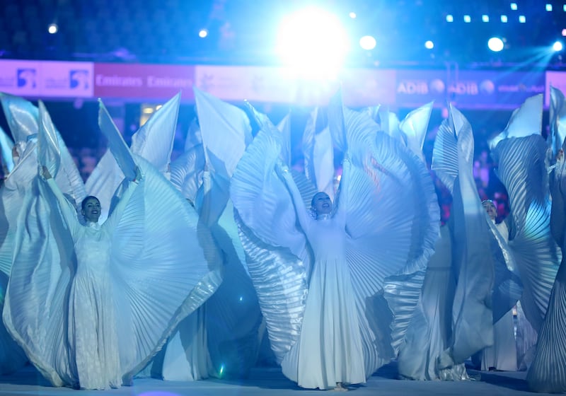 Performers in elaborate costumes during the opening ceremony.