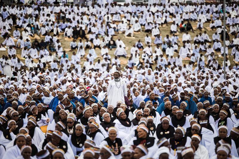 Thousands of members of the Nazareth Baptist Church at the annual prayer and reconciliation ceremony 400 kilometres north of Durban, South Africa. AFP

