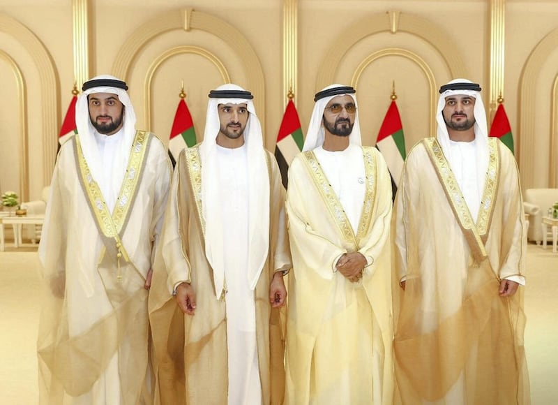 Sheikh Mohammed bin Rashid, Vice President and Ruler of Dubai, stands for a photograph with his sons, the grooms, Sheikh Hamdan bin Mohammed, Crown Prince of Dubai, Sheikh Maktoum bin Mohammed, Deputy Ruler of Dubai, and Sheikh Ahmed bin Mohammed, Chairman of the Mohammed bin Rashid Al Maktoum Knowledge Foundation. Courtesy Dubai Media Office