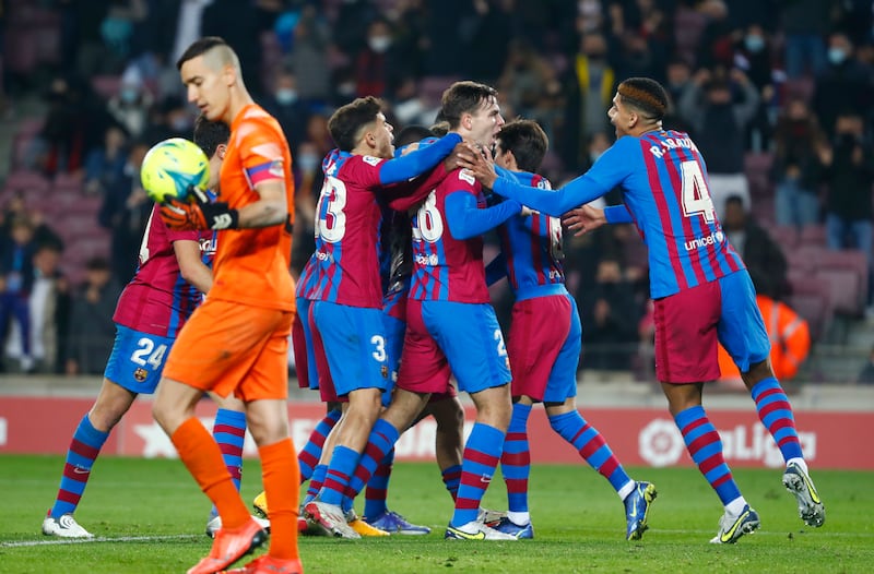 Barcelona's Nico Gonzalez, third from right, celebrates with his teammates after scoring his side's third goal. AP