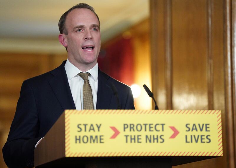 In this handout photo provided by 10 Downing Street, Britain's Foreign Secretary Dominic Raab answers questions from the media via a video link during a media briefing on coronavirus in Downing Street, London, Monday, March 30, 2020. The new coronavirus causes mild or moderate symptoms for most people, but for some, especially older adults and people with existing health problems, it can cause more severe illness or death. (Pippa Fowles/10 Downing Street via AP)