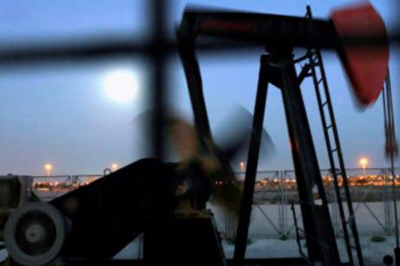 An oil pump works in the moonlight Wednesday, Nov. 12, 2008, in the oilfields of Sakhir, Bahrain, in the Persian Gulf. Oil prices dropped below $57 a barrel Wednesday on fears of stagnating global growth. Oil prices have plunged more than 60 percent in four months despite two recent OPEC production cuts. (AP Photo/Hasan Jamali) *** Local Caption ***  XHJ101_Mideast_Bahrain_Oil_Prices.jpg