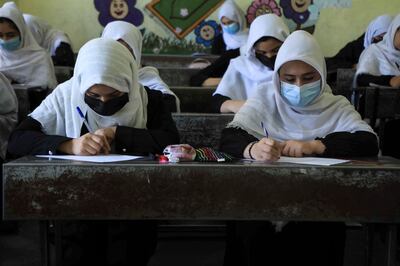 Schoolgirls attend class in Herat, following the Taliban takeover of the country. AFP