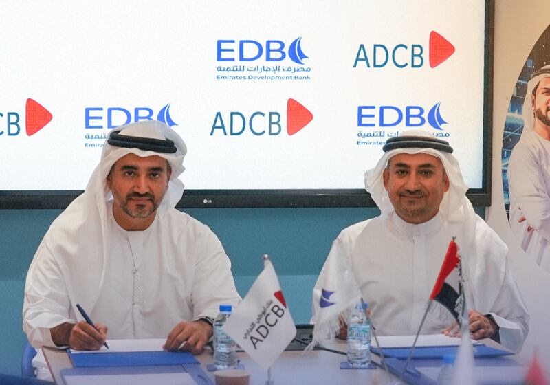 ADCB executive Saoud Al Jassem, left, and Shaker Zainal of EDB during the signing ceremony. Photo: EDB