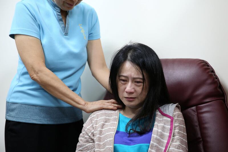 A relative of victims of a train derailment reacts at a hospital in Yilan, Taiwan. REUTERS