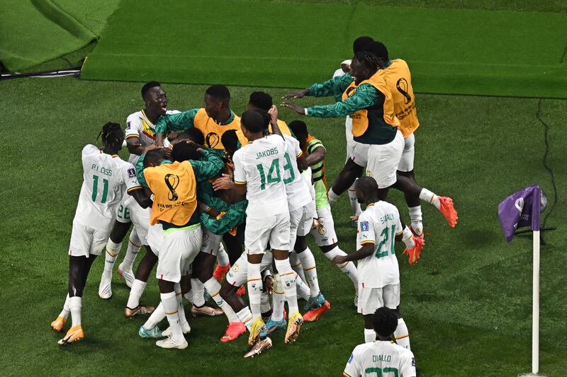 Ismaila Sarr celebrates his penalty with teammates. AFP
