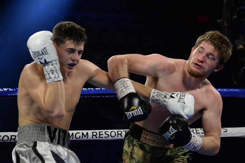 Vito Mielnicki (white trunks) and Corey Champion (green trunks) box during their welterweight bout at MGM Grand Garden Arena, Las Vegas.  Reuters