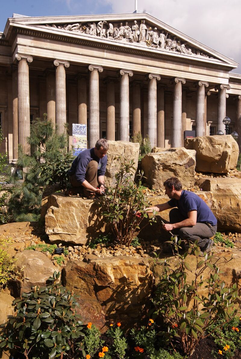 Gardeners from the Royal Botanic Gardens at Kew prune the foliage in an Indian-themed garden on the west lawn of the British Museum in 2009