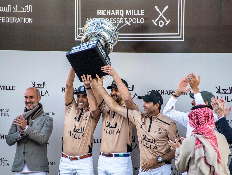 Members of the AlUla polo team celebrate their victory in the tournament.