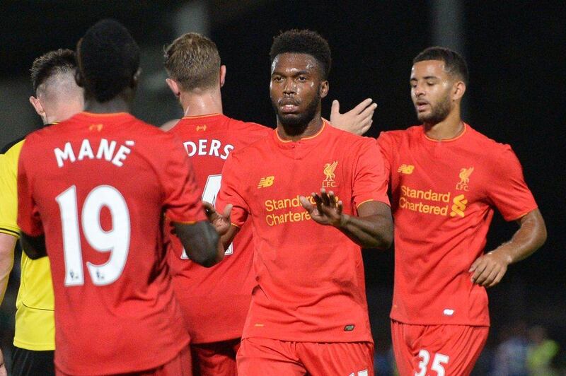 Daniel Sturridge, centre, has voiced his concern over being played in a wide position instead of his preferred centre-forward role. Oli Scarff / AFP
