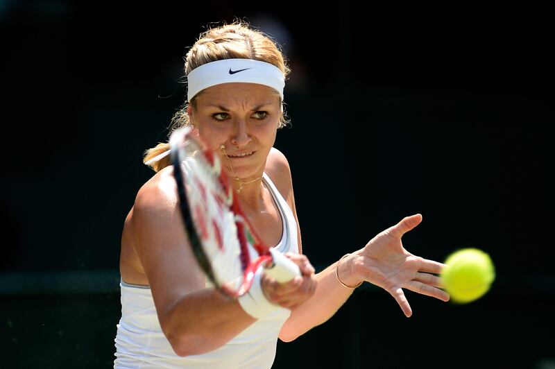 LONDON, ENGLAND - JULY 06:  Sabine Lisicki of Germany plays a forehand during the Ladies' Singles final match against Marion Bartoli of France on day twelve of the Wimbledon Lawn Tennis Championships at the All England Lawn Tennis and Croquet Club on July 6, 2013 in London, England.  (Photo by Dennis Grombkowski/Getty Images) *** Local Caption ***  173066912.jpg