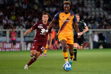 Torino's Samuele Ricci, left, and Roma's Tammy Abraham fight for the ball during the Italian Serie A soccer match between Torino and Roma at the Olympic Stadium in Turin, Italy, Friday, May 20, 2022.  (Alberto Gandolfo / LaPresse via AP)