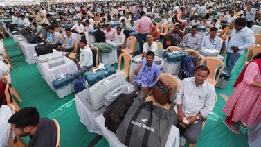 Election staff wait with the Voter Verifiable Paper Audit Trails and Electronic Voting Machines at a distribution centre in Bikaner, Rajasthan, on Thursday. Reuters