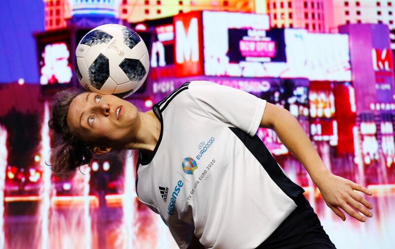 Kitti Szasz, the Hungary freestyle football champion, performs at the start of the Hisense news conference. AP Photo