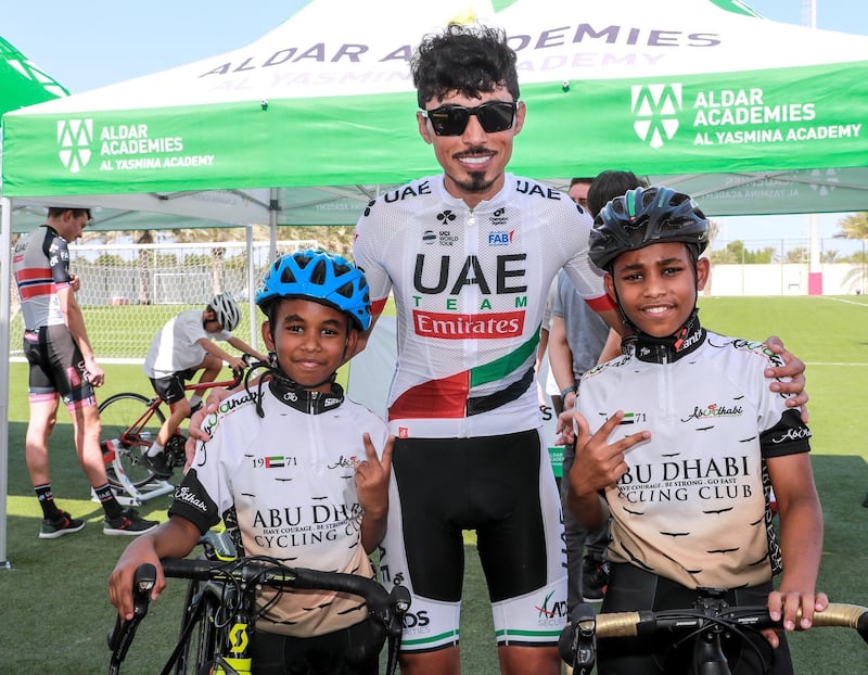 Abu Dhabi, U.A.E., October 29, 2018.  UAE Cycling Team Emirates visit the Al Yasmina School to give a brief cycling workshop. -- Yousif Mirza withthe Maqbul brothers, Ahmed-9 and Omar-12.
Victor Besa / The National
Section:  SP
Reporter:  Amith Passela