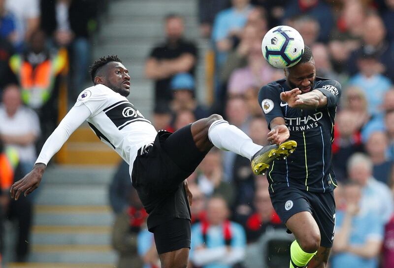 Fulham's Andre-Frank Zambo Anguissa in action with Manchester City's Raheem Sterling. Reuters