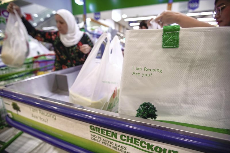 Abu Dhabi, United Arab Emirates, March 10, 2020. Lulu Hypermarket going plastic bag free and cleanliness-conscious to combat the Covid-19 outbreak.  A green checkout line at LuLu Hypermarket, Khalidiyah Mall. Victor Besa / The NationalSection:  NAReporter:  Haneen Dajani