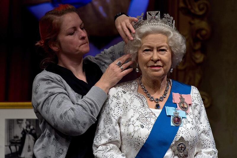 Madame Tussauds refreshes its Queen Elizabeth II wax figure with a recreation of the longest reigning monarch’s diamond jubilee dress at Madame Tussauds on September 7, 2015 in London, England. The wax figure was updated after Buckingham Palace announced that on September 9, 2015 Queen Elizabeth II would surpass Queen Victoria as the longest reigning monarch. Ben Pruchnie / Getty Images