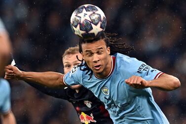 Manchester City's Dutch defender Nathan Ake headers the ball during the UEFA Champions League round of 16 second-leg football match between Manchester City and RB Leipzig at the Etihad Stadium in Manchester, north west England, on March 14, 2023.  (Photo by Paul ELLIS  /  AFP)