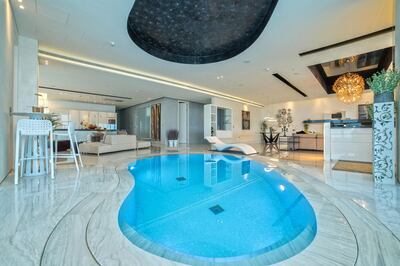 The swimming pool is located in the middle of the apartment's living room. Courtesy Allsopp and Allsopp