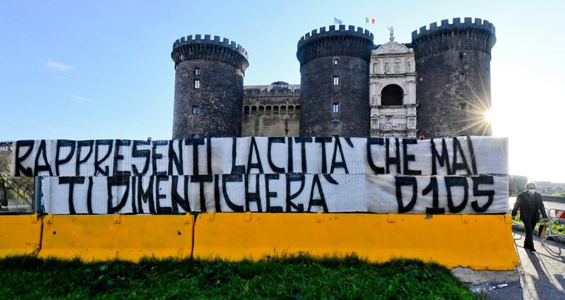 A banner reading 'You represent the city that will never forget you' has been placed in front of the Maschio Angioino castle to pay tribute to Diego Maradona. EPA
