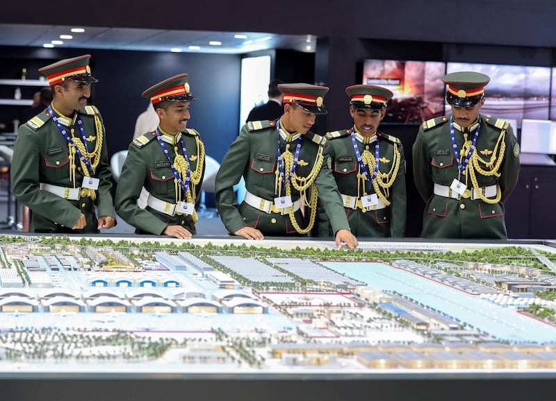 Dubai, United Arab Emirates - November 20, 2019: Members of the UAE army look at a model of Mohammed Bin Rashid Aersospace hub at the Dubai airshow. Wednesday, November 20th, 2017 at Dubai Airshow, Dubai. Chris Whiteoak / The National