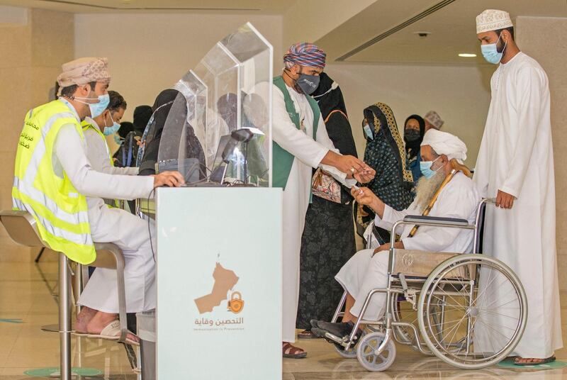 People register to get vaccinated at the Oman Convention & Exhibition Centre in the capital Muscat on June 23, 2021 during the second phase of the national immunisation plan against COVID-19. / AFP / Haitham AL-SHUKAIRI
