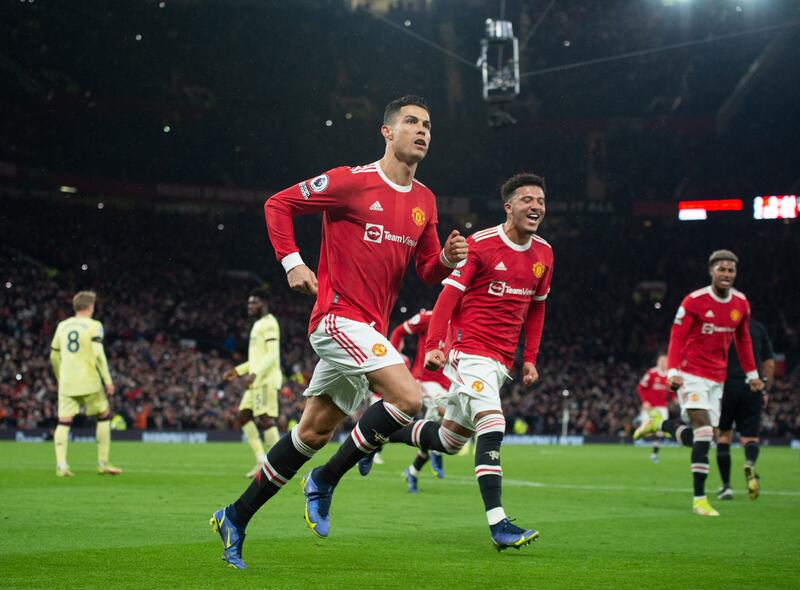 Manchester United's Cristiano Ronaldo celebrates after scoring during the Premier League match against Arsenal at Old Trafford in December 2021. EPA