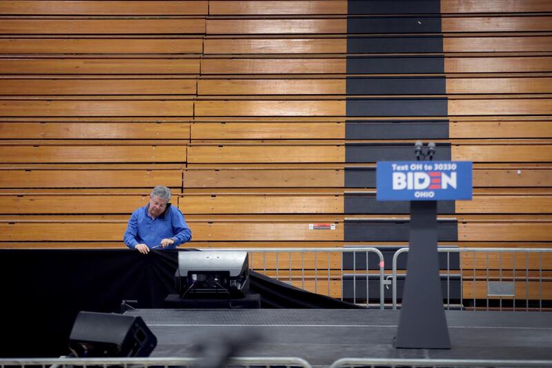 Workers begin to tear down the setup at Cuyahoga Community College where Democratic presidential candidate former Vice President Joe Biden was scheduled to appear at an election-night rally on March 10, 2020, in Cleveland, Ohio. AFP