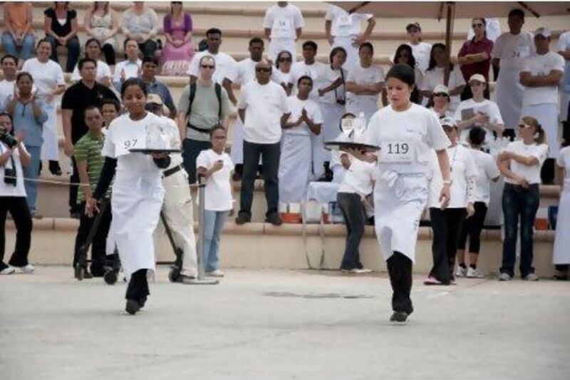 Waiters and waitresses from across Abu Dhabi showed a friendly rivalry as they went head-to-head at Khalifa Park.