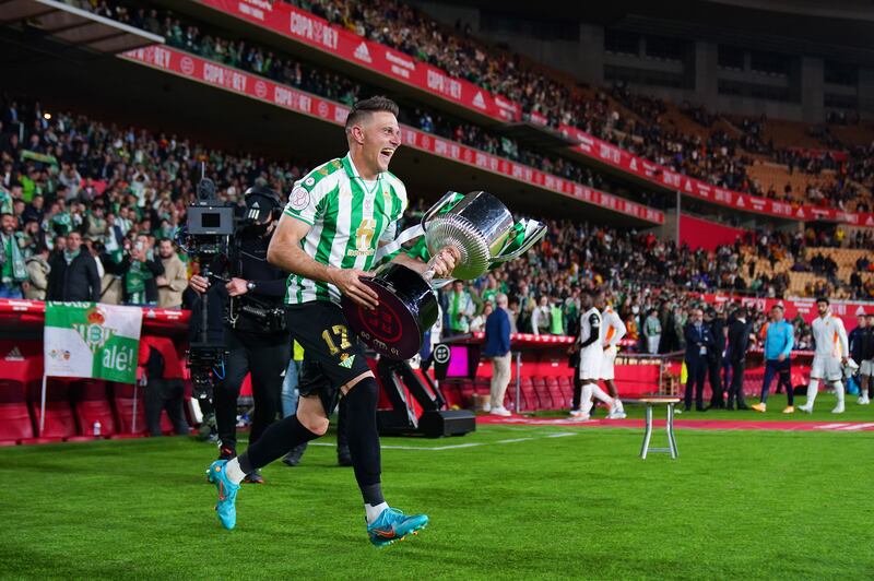 Joaquin runs on to the pitch with the Copa del Rey trophy. Getty