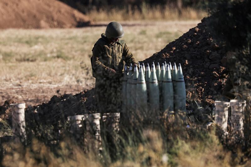 An Israeli soldier works at an artillery unit near the border between Israel and the Gaza strip, on the Israeli side. Reuters