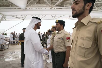 ABU DHABI, UNITED ARAB EMIRATES - April 23, 2018: HH Sheikh Mohamed bin Zayed Al Nahyan Crown Prince of Abu Dhabi Deputy Supreme Commander of the UAE Armed Forces (L), awards a member of the UAE Armed Forces with a Medal of Bravery for his service in Yemen, during a Sea Palace barza.

( Mohamed Al Hammadi / Crown Prince Court - Abu Dhabi )
---