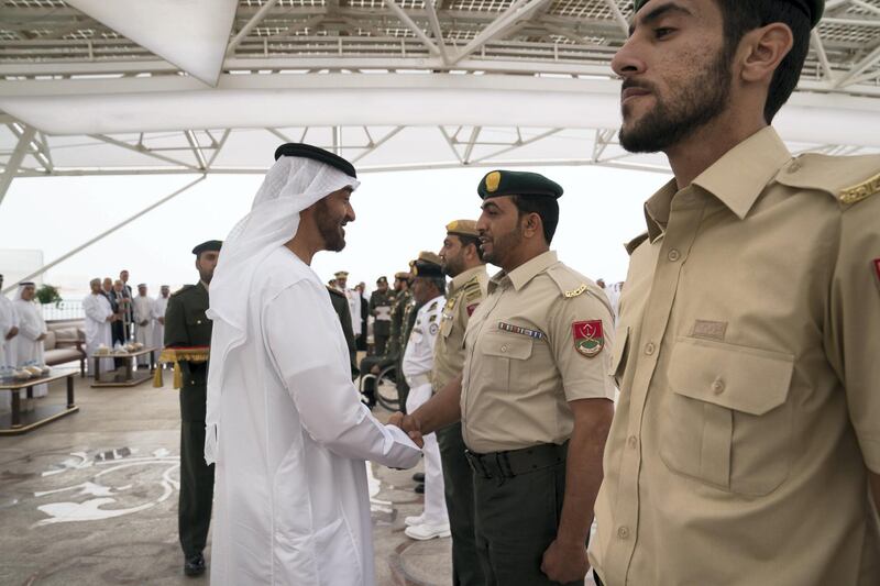 ABU DHABI, UNITED ARAB EMIRATES - April 23, 2018: HH Sheikh Mohamed bin Zayed Al Nahyan Crown Prince of Abu Dhabi Deputy Supreme Commander of the UAE Armed Forces (L), awards a member of the UAE Armed Forces with a Medal of Bravery for his service in Yemen, during a Sea Palace barza.

( Mohamed Al Hammadi / Crown Prince Court - Abu Dhabi )
---