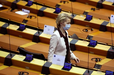 European Commission President Ursula von der Leyen wearing a mask to protect against coronavirus, leaves the main chamber of the European Parliament in Brussels, Thursday, July 23, 2020. European leaders took a historic step towards sharing financial burdens among the EU's 27 countries by agreeing to borrow and spend together to pull the economy out of the deep recession caused by the coronavirus outbreak. (AP Photo/Francisco Seco)