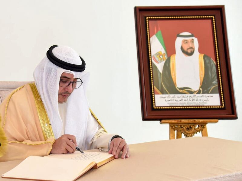 Kuwaiti Foreign Minister Sheikh Ahmed Nasser Al Mohammed Al Sabah writes in the book of condolences. AFP