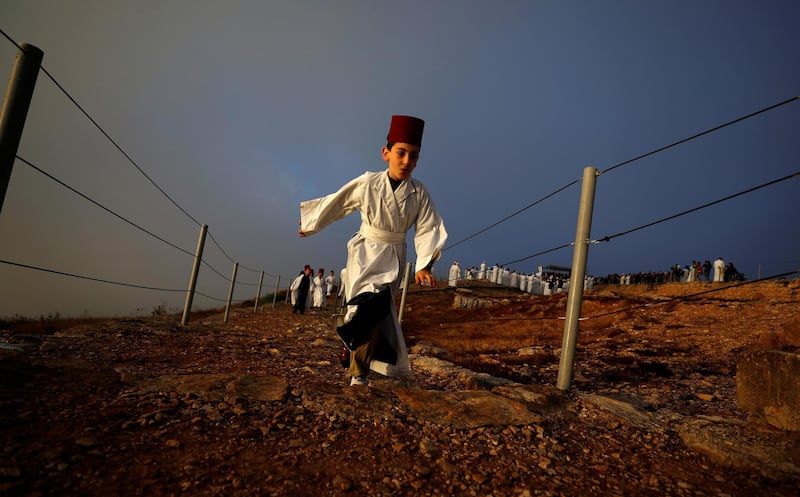 A member of the Samaritan sect takes part in a pilgrimage marking the holiday of Shavuot, on top of Mount Gerizim, near Nablus, in the Israeli-occupied West Bank. Reuters