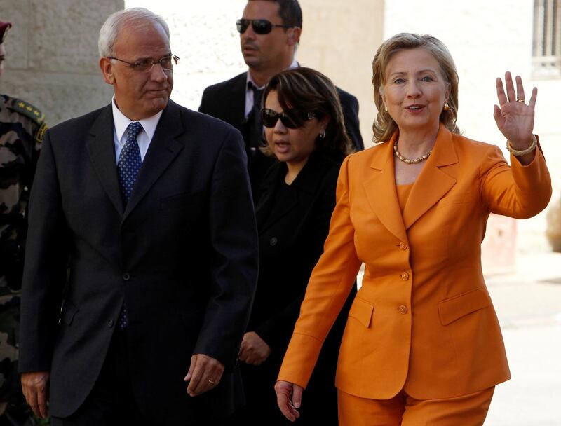 US Secretary of State Hillary Clinton waves as she walks with chief Palestinian negotiator Saeb Erekat upon her arrival for a meeting with Palestinian President Mahmoud Abbas in the West Bank city of Ramallah on September 16, 2010. Reuters