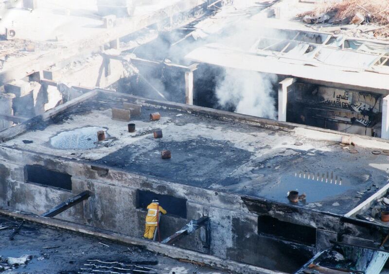 This image taken in 2003 shows the fire which destroyed Abu Dhabi's original souk, popularly known as the old souk or old central market. (Al Ittihad)  *** Local Caption ***  Abu Dhabi Souk Fire010.jpg