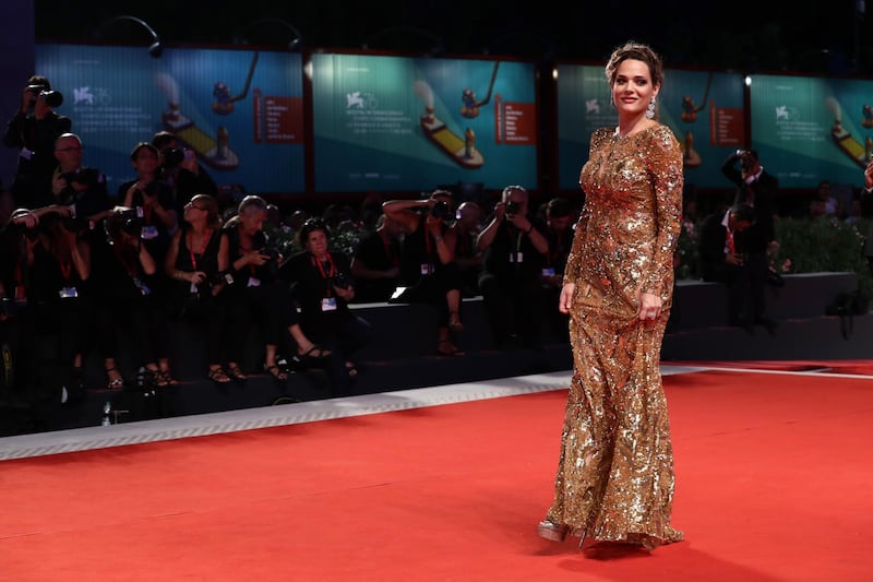 Laura Chiatti walks the Filming In Italy red carpet during the 76th Venice Film Festival. Getty