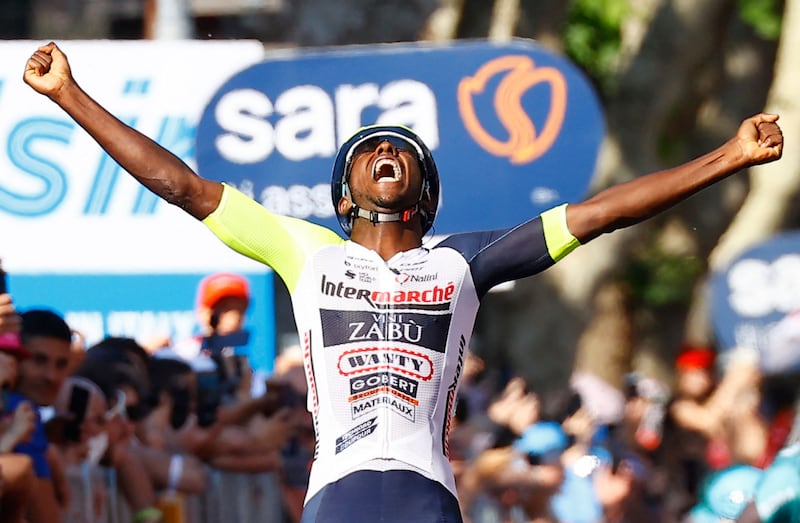 Team Wanty's Eritrean rider Biniam Girmay celebrates as he crosses the finish line to win Stage 10. AFP