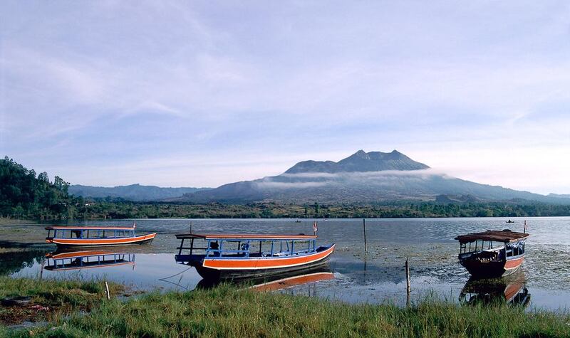 Cycle down the path cutting through the Gunur Batur volcano in Bali’s central mountainous area. iStock