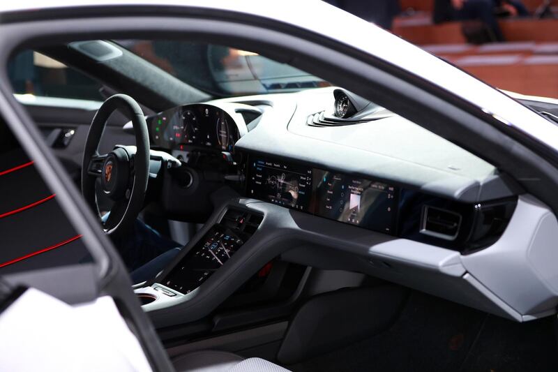 Touchscreen dashboard monitors sit inside the all electric Porsche AG Taycan luxury automobile. Bloomberg