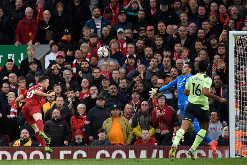 Liverpool's Diogo Jota puts a header over the crossbar. AFP
