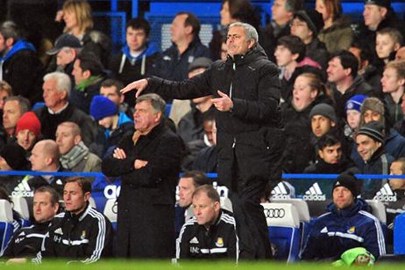 Jose Mourinho, right, was left frustrated by West Ham's holding out for a draw during their London derby at Stamford Bridge. Glyn Kirk / AFP