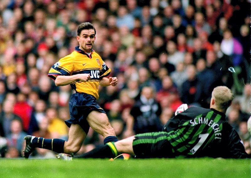 14 Mar 1998:  Marc Overmars of Arsenal scores the winner against Manchester United during the FA Carling Premiership match at Old Trafford in Manchester, England. Arsenal won 1-0. \ Mandatory Credit: Shaun Botterill /Allsport