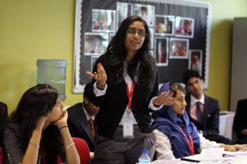 DUBAI, UNITED ARAB EMIRATES - MARCH 24:  Students participate in a Model United Nations Conference at the Dubai International Academy in Dubai, on March 24, 2011. Over 400 students are taking part in the three-day event from 28 different schools and nine countries. The theme of the conference is the 'Advancement of Technology'. Pictured is Roshna Bahauddin (C), representing China, and speaking at a "security council" session.  (Randi Sokoloff for The National)  For News story by Afshan AhmedAhmed