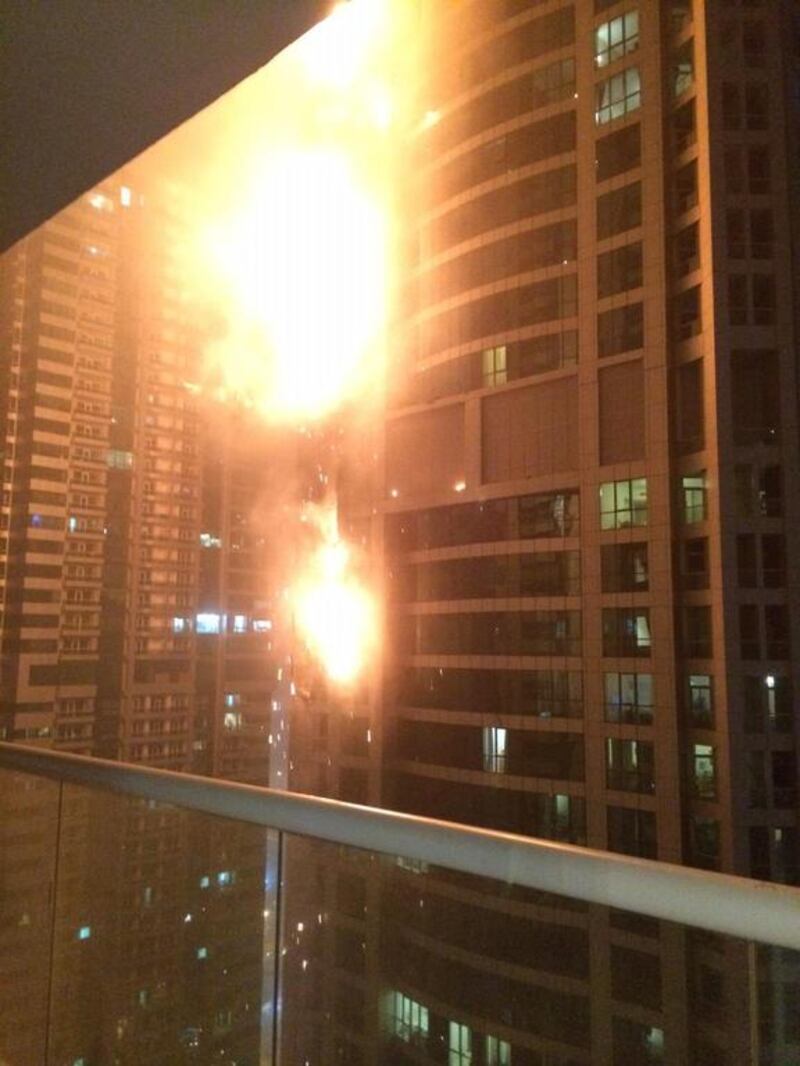 Residents of at least one neighbouring tower were told to evacuate as a precaution because of strong winds, but they were later allowed back inside. AP