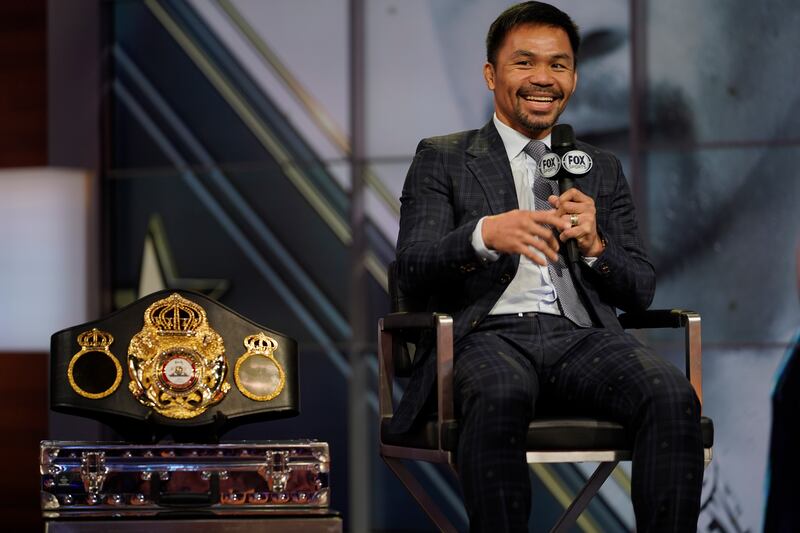 Boxer Manny Pacquiao smiles during a news conference with Errol Spence Jr on Sunday, July 11, 2021, at the Fox Studios lot in Los Angeles ahead of their upcoming boxing match.